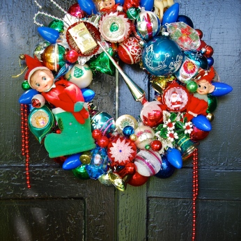 ELF MAGIC. For the Mid-century kids, so many happy memories rolled into this wreath studded with elves and old C9 bulbs galore. 17" diameter $245 SOLD