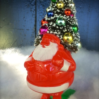 Vintage Santa on skis candy container with a decorated bottlebrush tree in his sack $42 *SOLD*