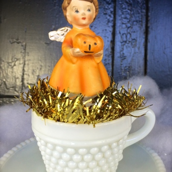 October angel in a milk glass cup&saucer $36